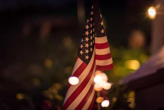 American Flag And Sparklers At Night On 4th Of July