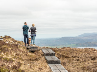 Man, Dog, and Woman on Torc Mountain