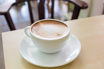 coffe latte cup on a wood table