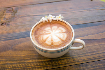 Coffee latte cup with milk on the table