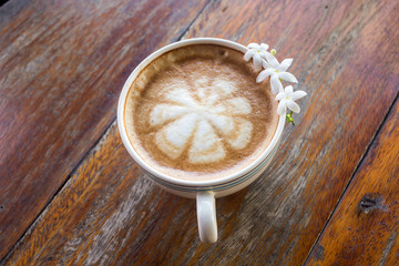 Coffee latte cup with milk on the table