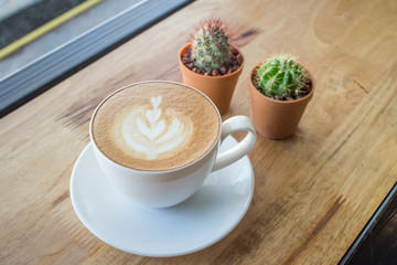 Obraz na płótnie Canvas Coffee cup with milk on the table