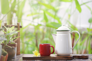 White teapot and red cup