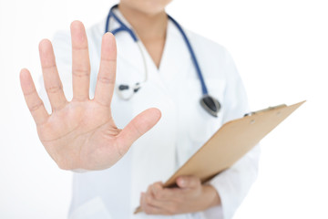 ストップのジェスチャーをする女医