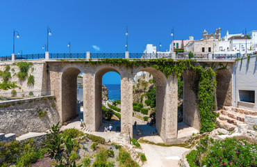 Fototapeta na wymiar Polignano a Mare (Puglia, Italy) - The famous sea town in province of Bari, southern Italy. The village rises on rocky spur over the Adriatic Sea, and is known tourist attraction.