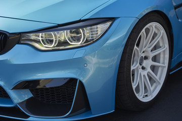 Clean California car; blue performance machine with white wheels