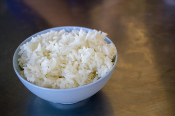 white rice in plastic bowl