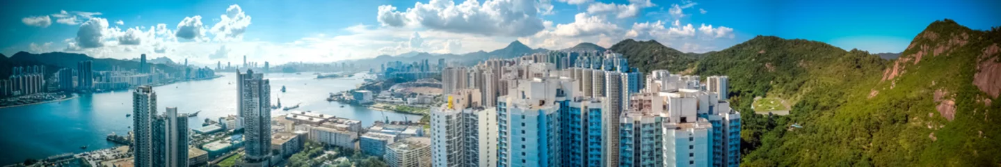 Fototapeten Panoramic view of Hong Kong city from sky on Lei Yue Mun © YiuCheung