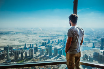 Man staring out of Window