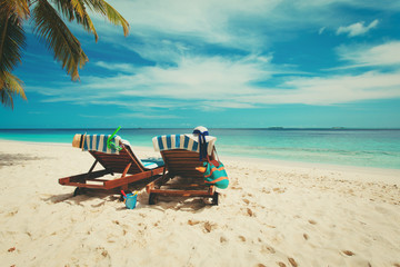 Two beach chairs on tropical vacation