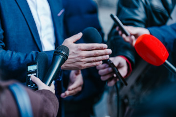 Interviewing businessman on press conference