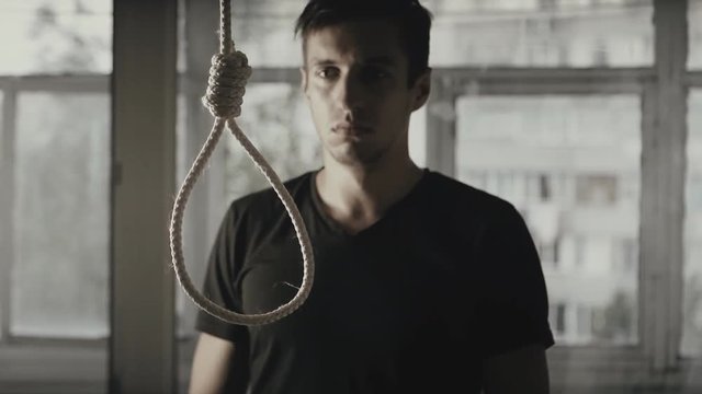 The man wants to hang himself. The guy is depressed and wants to do suicide.