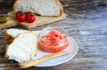 Pa amb tomaquet  or  pa amb tomaca (bread with tomato) is a popular snack of Catalan cuisine. Close up of typical tapa in Catalonia,Spain.