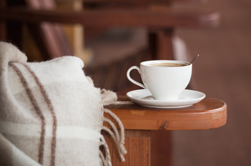 cup of coffee and plaid on terrace