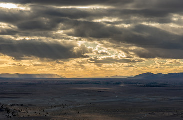 Obraz premium View of Bani mountains from Zagora with dramatic sky and palm oasis, Morocco