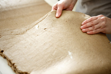 the Baker rolls rye puff pastry on special equipment. selective focus