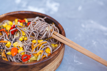 Buckwheat soba noodles with vegetables. Love for a healthy vegan food concept.