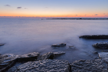 Fototapeta premium Sunrise on the wild beach of the Caspian Sea coast near Baku