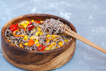 Buckwheat soba noodles with vegetables. Love for a healthy vegan food concept.