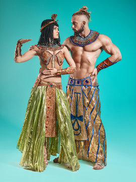 The man, woman in the images of Egyptian Pharaoh and Cleopatra