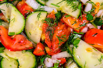 Background of salad with cucumbers and tomatoes