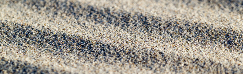 Lines in the sand of a beach. Sand texture. Long banner