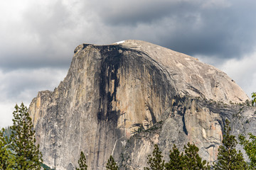 Yosemite's Half Dome in Spring with Ominous Clouds approaching from behind it