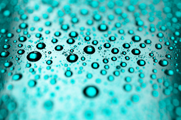 Water drops on blue green background