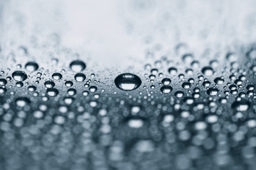 Rain drops on the surface, blue background