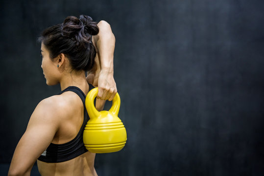 Young Asian Woman Doing Exercise With Kettle Bell, Healthy Lifestyle Concepts