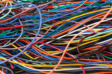 Colorful mess of cables wires and connectors
