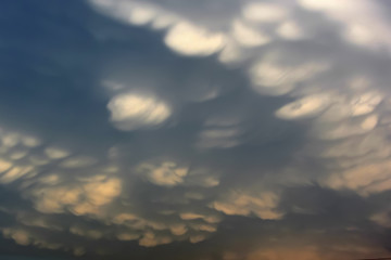 Wavy hilly dark clouds on the sky, kind undulatus asperatus