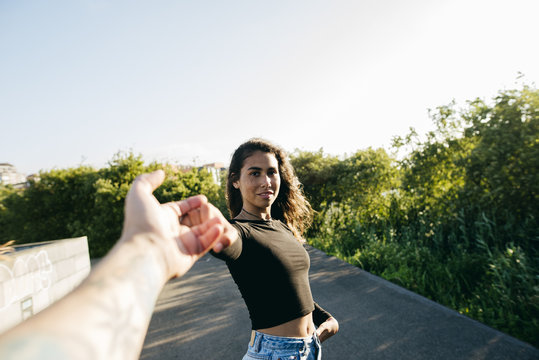 Girl holding male hand