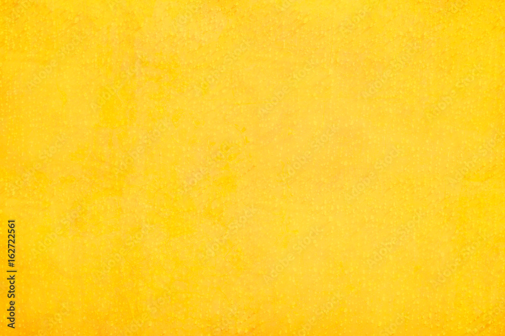 Wall mural texture and background of yellow concrete wall..