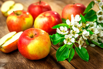 Raw organic apples on wooden background