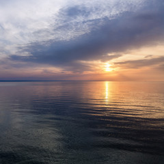 sunrise on the water / Early summer morning bright sky Beach