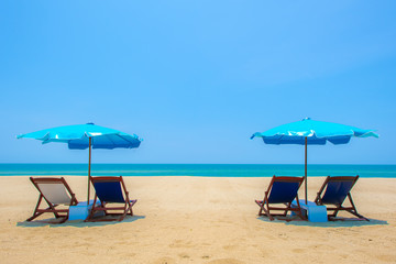 Relaxing on the beach with the bright blue and clear sky.