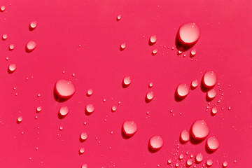 Red abstract background, water drops