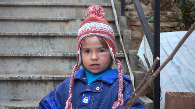 4K Tantrumy child with swell under his eye outdoors