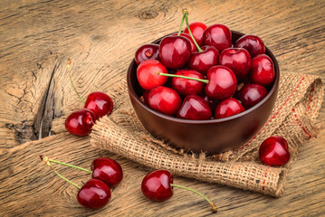 Cherries on wooden background