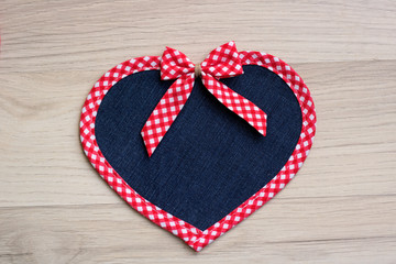 A seamless heart with a decorative tape and a bow like a background and copy space