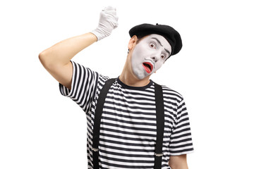 Mime artist hanging himself with an imaginary rope