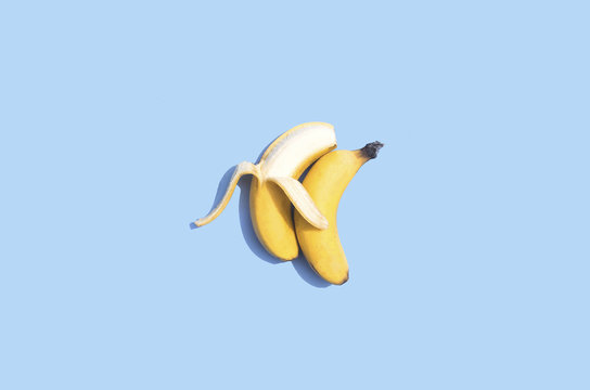 Conceptual bananas on blue background 