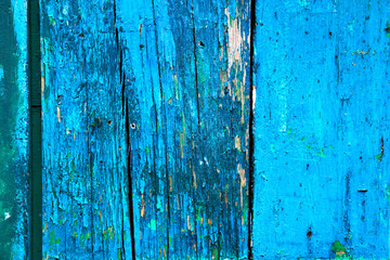 Fototapeta na wymiar Boards with peeling blue paint