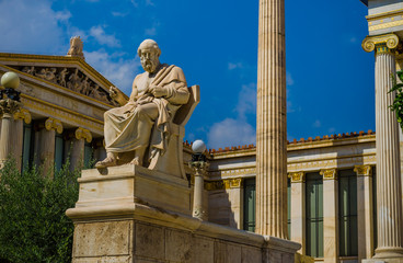 Marble statue of the philosopher Plato on the background of Greek Academy.