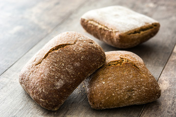 Rustic bread on wooden table