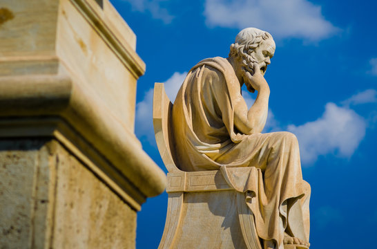 Close-up statue of the Greek philosopher Socrates on the background of Sky.