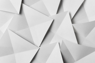 Geometric shapes of paper, white background