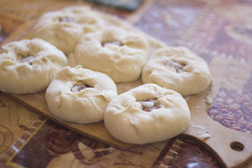 a pie with meat and onions