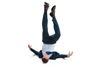 young businessman in suit falling upside down isolated on white